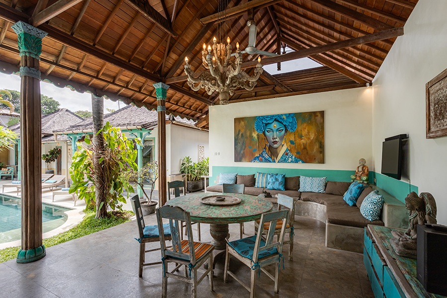 The central building features the open lounge living area, dining table and fully equipped kitchen